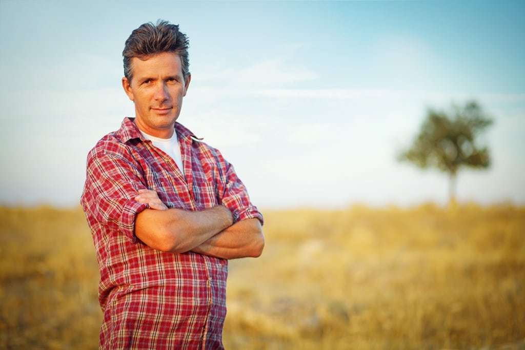 outdoor portrait of a man in the filed 